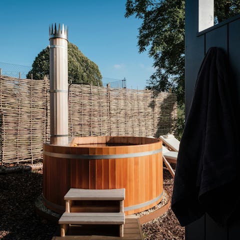 Enjoy a glass of English sparkling wine in the wood-fired hot tub