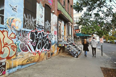 Explore Bushwick’s colourful street art, independent galleries, cafes, and creative spaces