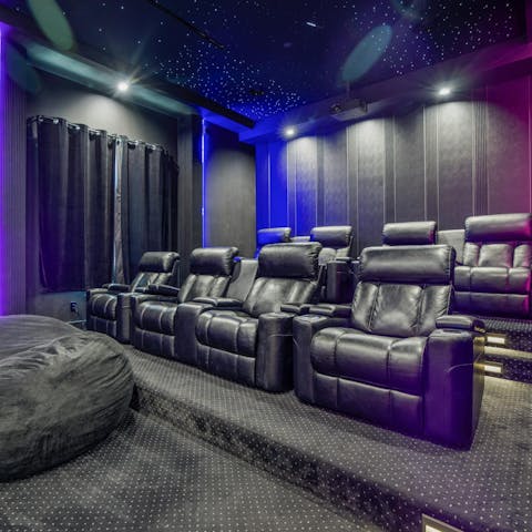 Watch your favourite movie in the luxurious private home theatre