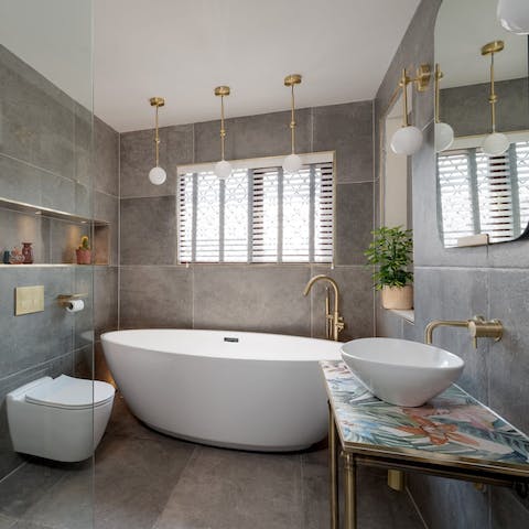 Take some time for a relaxing soak in the freestanding bathtub