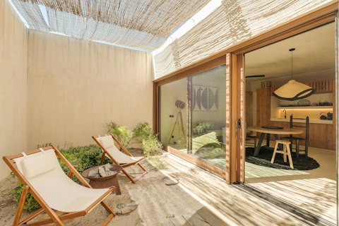 Recline in the sheltered walled courtyard, warm stone underfoot and nowhere to be