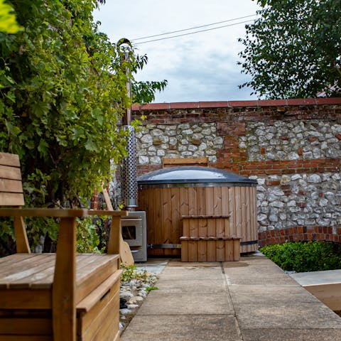 Sit back and relax in the log-burning hot tub