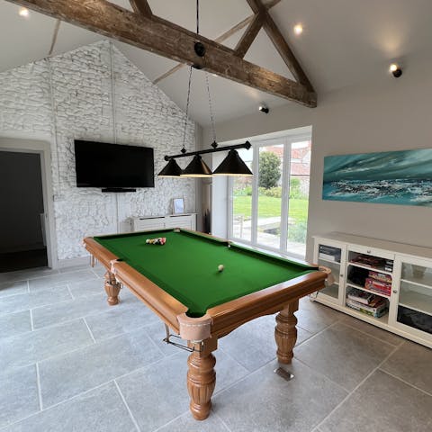 Play a round or two of pool in the games room