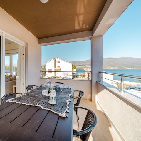 Enjoy an alfresco meal overlooking the sea