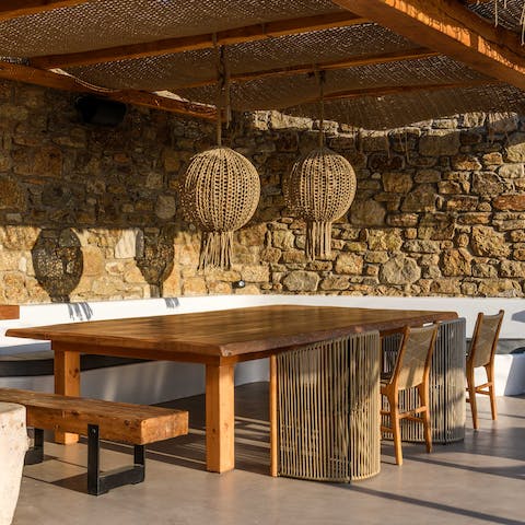 Sit up to the outdoor dining table & feast on fresh Greek salad and souvlaki