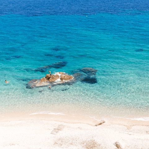 Take a trip to Ftelia Beach, just a five–minute drive away from the villa
