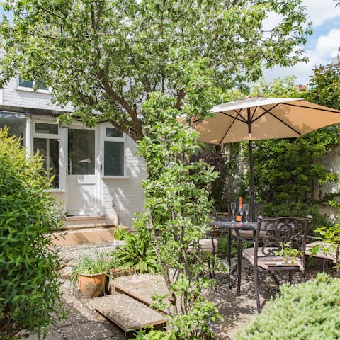 Pop open a bottle of wine and enjoy the peace of your courtyard garden