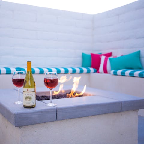 Get cosy by the minimalist firepit