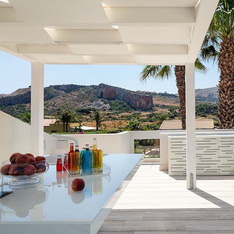 Mix up a cocktail pitcher on the roof terrace, accompanied by mountain vistas