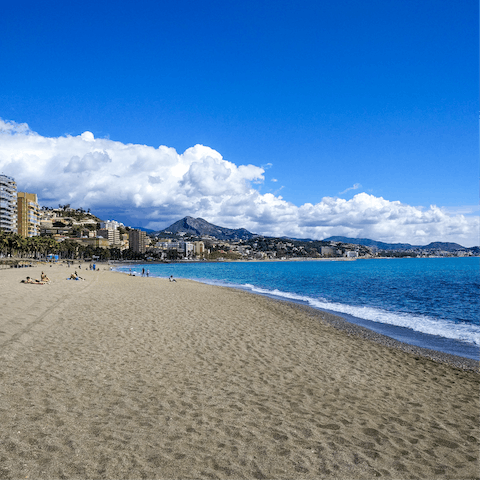Catch some rays at Malagueta Beach, a short walk from home