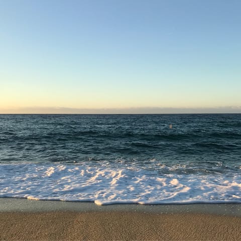 Watch the sunset on Peristera Beach, around 350 metres away
