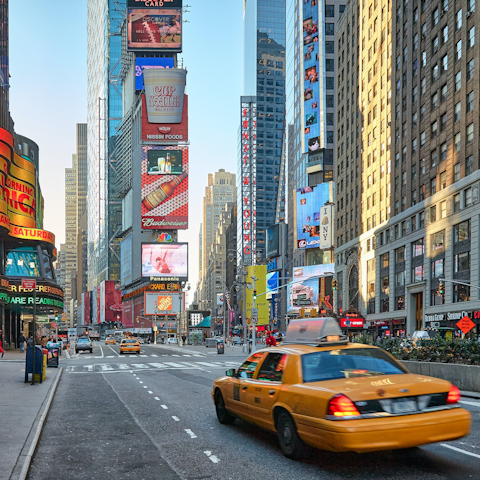 Visit Times Square at night and admire the bright lights