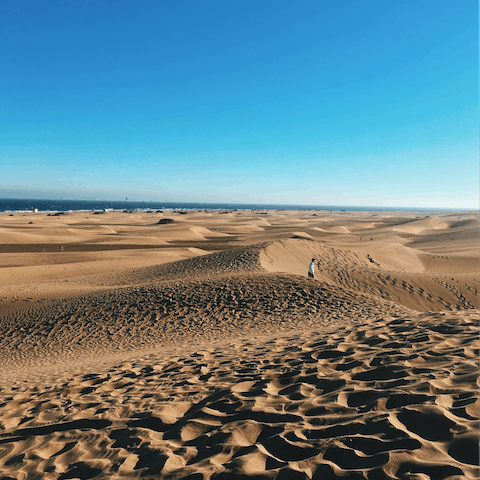 Feel the sand beneath your feet at Maspalomas’ beach and dunes – just an eight-minute drive away