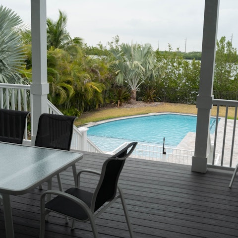 Sip a sundowner overlooking the private pool