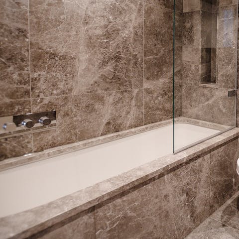 Forget chilly, winter nights – soak in the tub in the marble-clad bathroom
