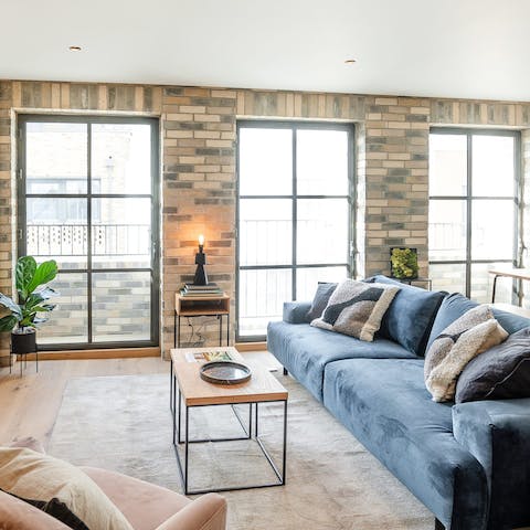 Step out to your private balcony from the bright lounge, glass of wine in hand