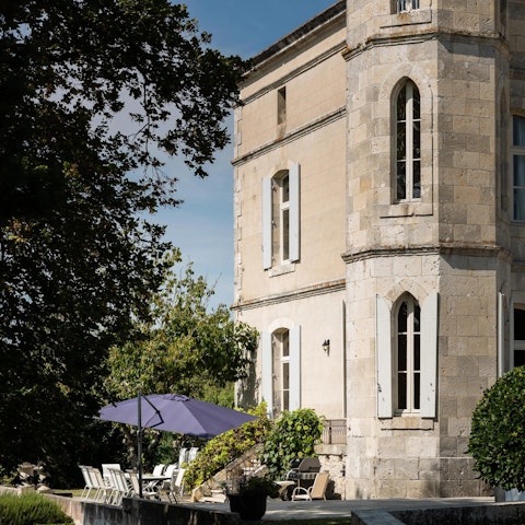 Find a sunny spot on the terrace to relax or dine with views across the lake