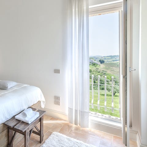 Wake up after a restful sleep and open your door to soak in the incredible vista from your Juliet balcony