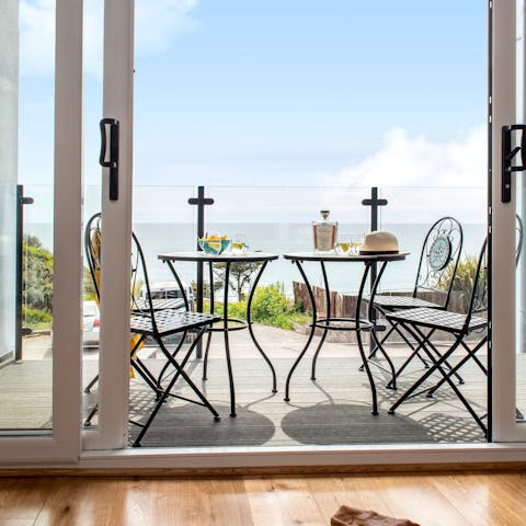 Gaze out across the sea over drinks and nibbles