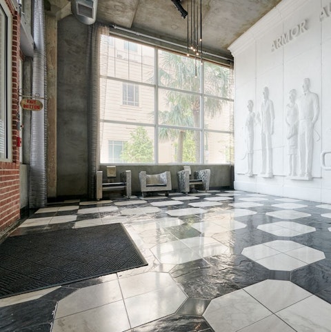 Descend the stairs to the majestic marble floors of the main lobby