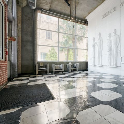 Descend the stairs to the majestic marble floors of the main lobby