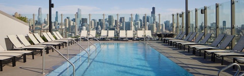 Head to the communal rooftop for a swim beneath city skies