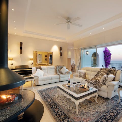 Gather around the sleek fireplace for a game of cards