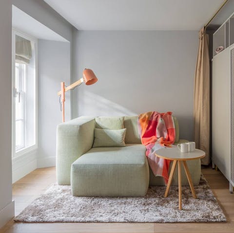 Curl up on the mint green sofa at the end of a busy day of exploring