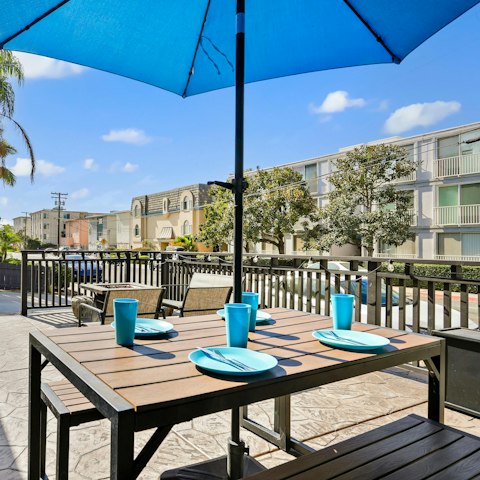 Tuck into freshly grilled food on the sunny terrace