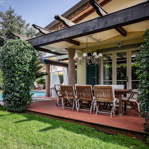 Dine in style under the chandelier on your covered terrace