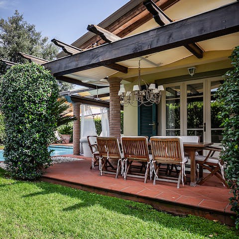 Dine in style under the chandelier on your covered terrace