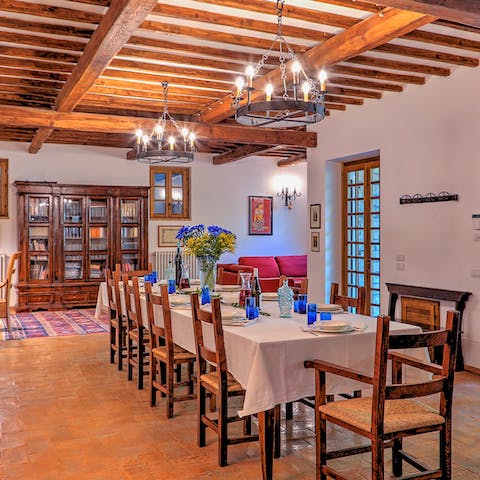 Dine under candelabra within the traditional interior