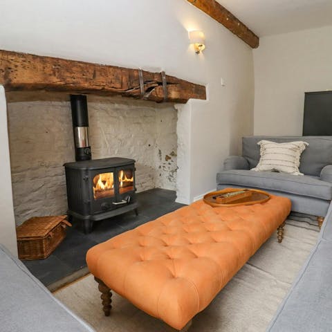 Spend cosy evenings curled up around the wood-burning stove