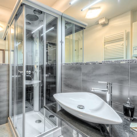 Start mornings with a luxurious soak under the bathroom's rainfall shower