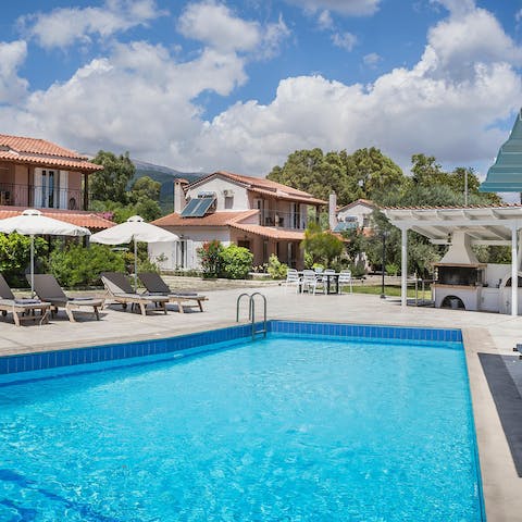 Relax by the communal pool, before rustling up something on the barbeque