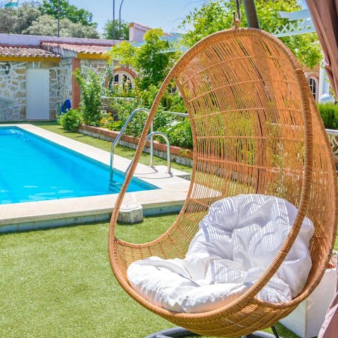 Relax with a good book and a glass of rioja by the pool