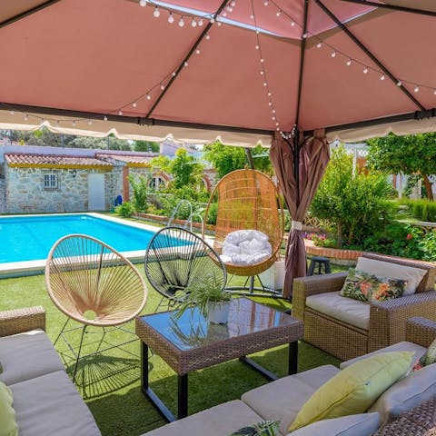 Enjoy an afternoon with cocktails and tapas in the shaded seating area