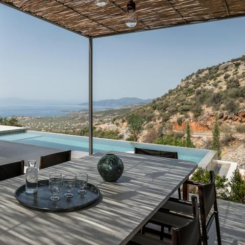 Enjoy a meal overlooking the sea and mountains
