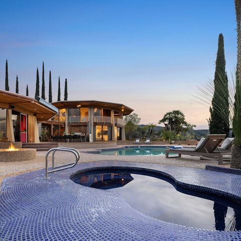 Toast to a happy holiday while relaxing in the hot tub and watching the sunset