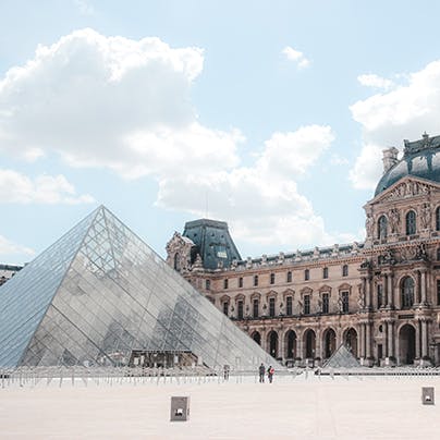Visit the iconic Louvre Museum, a short walk away