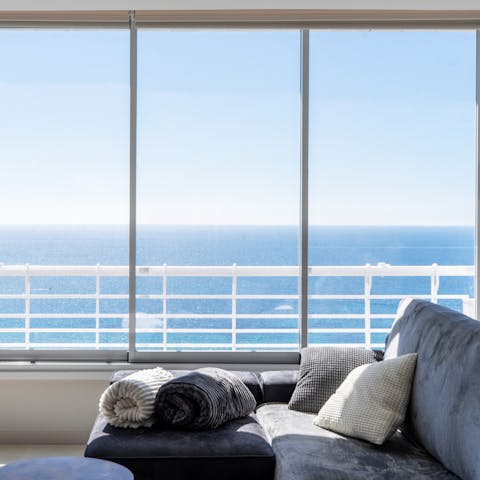 Sit back on the sofa and soak in the sweeping sea views