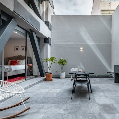 Roll out of bed and have coffee in the courtyard