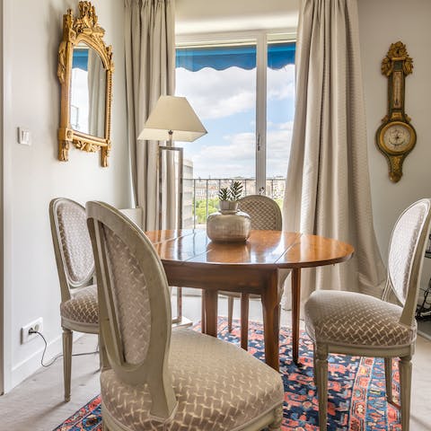 Take in views over the Parisian rooftops while you dine