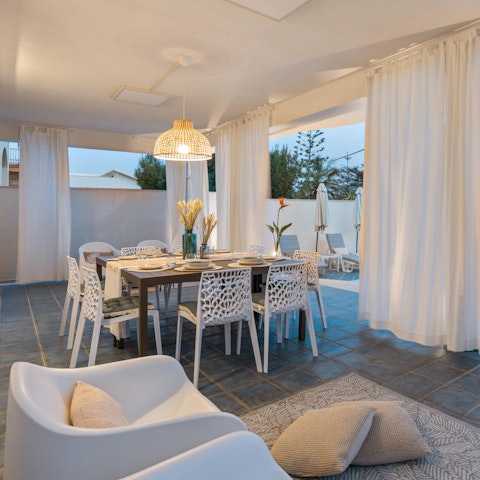 Gather on the covered terrace for dinner and drinks