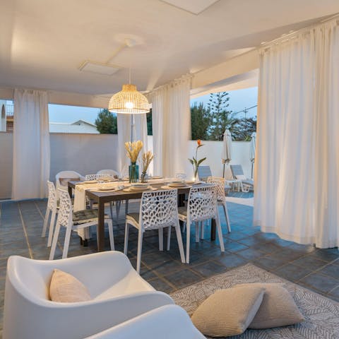 Gather on the covered terrace for dinner and drinks