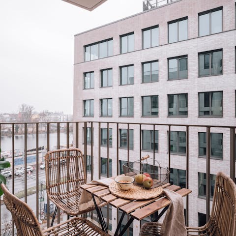 Enjoy views of the River Spree from the private balcony