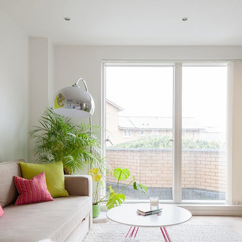 Open the sliding doors onto the terrace and relax on the comfy sofa