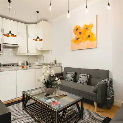 Have a seat on the comfy, grey sofa after a day of sightseeing in London