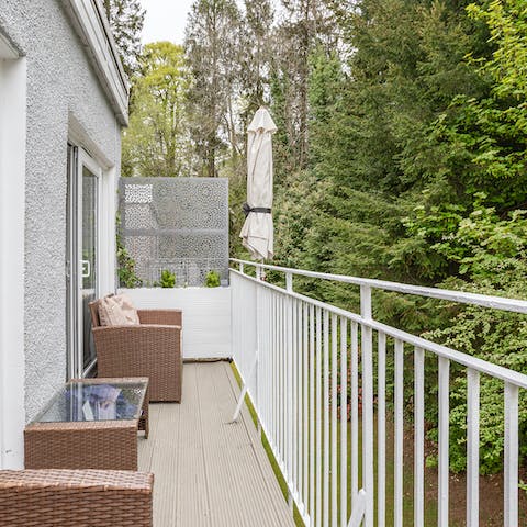 Relax on the balcony with a cool drink after a day in the great outdoors