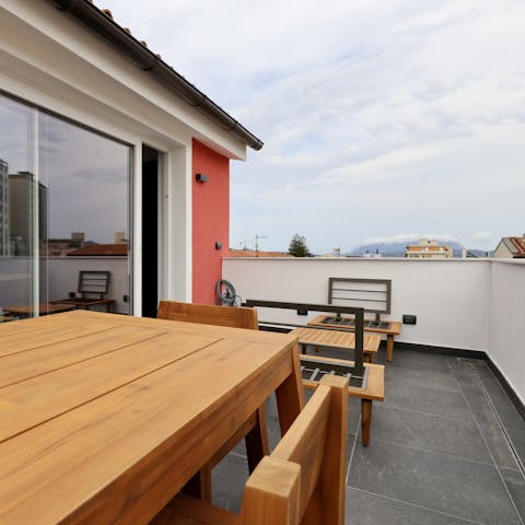 Relax on the private terrace, complete with rooftop views